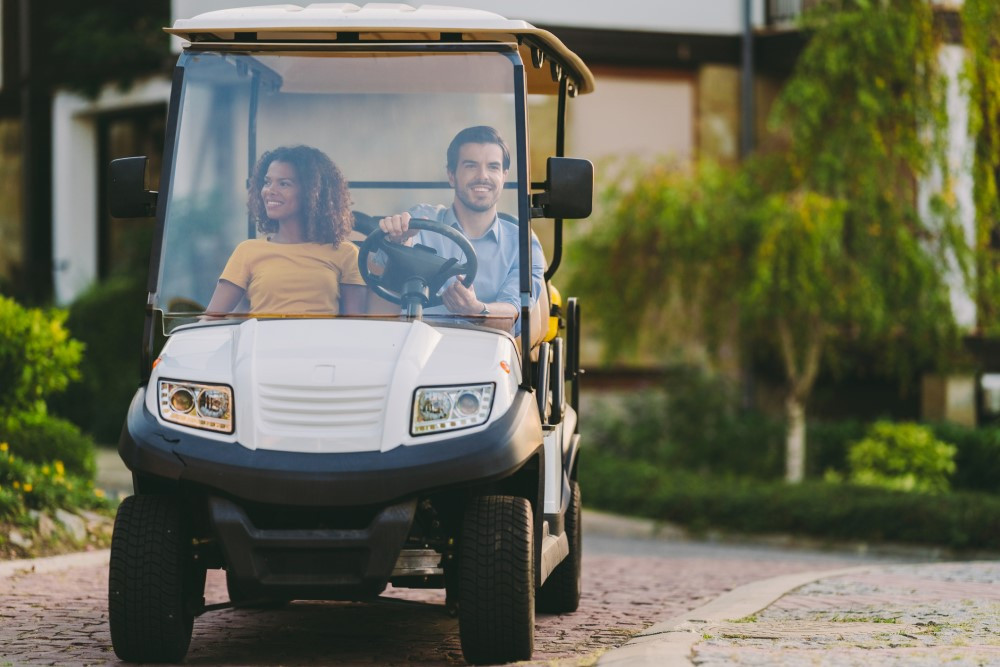 Couple in golf cart