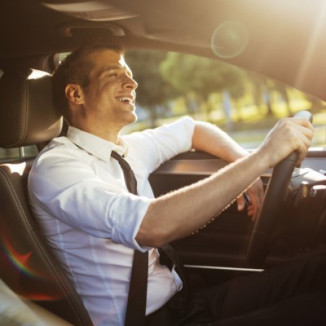 Businessman driving a car